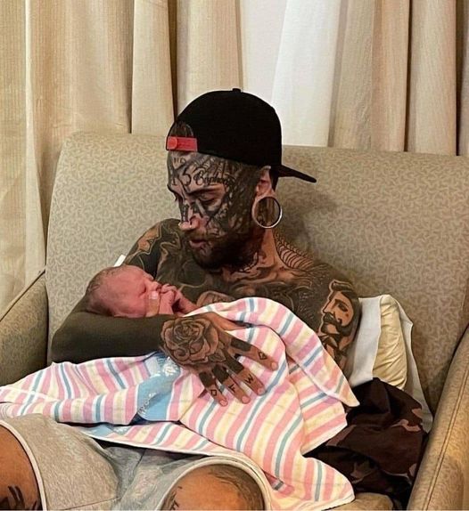 A 24-year-old father, who has several tattoos all over his body, makes the decision