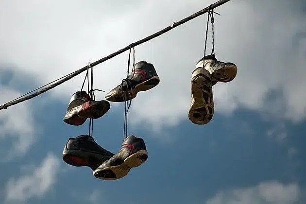 The Mystery Behind Sneakers Hanging from Power Lines.