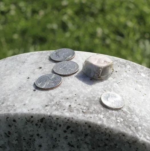 Have you ever come across a coin resting on a gravestone and wondered what it meant