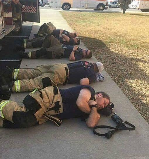 Man snaps heartbreaking photo of firefighters taking a rest after 24 hours of working nonstop