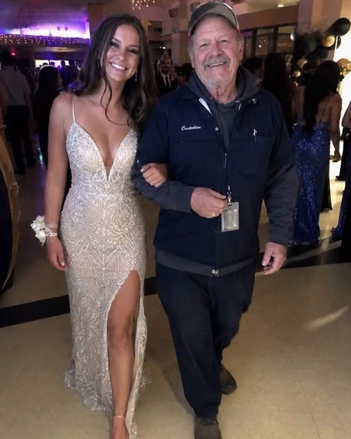 My Daughter Chose the School Janitor to Walk Her Across the Graduation Field Instead of Me – I Felt Embarrassed Until He Pulled an Old Envelope from His…